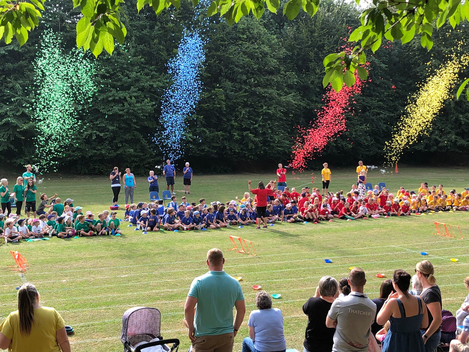 Four custom filled confetti cannons at school sports day