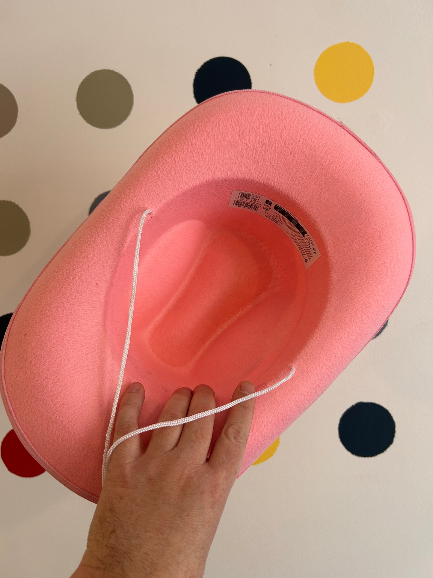 underneath pink cowboy hat