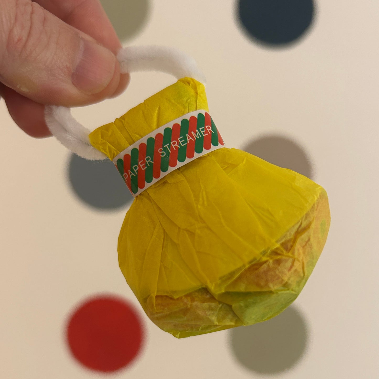 Multi-colour Hand Throw Streamer in yellow packaging.
