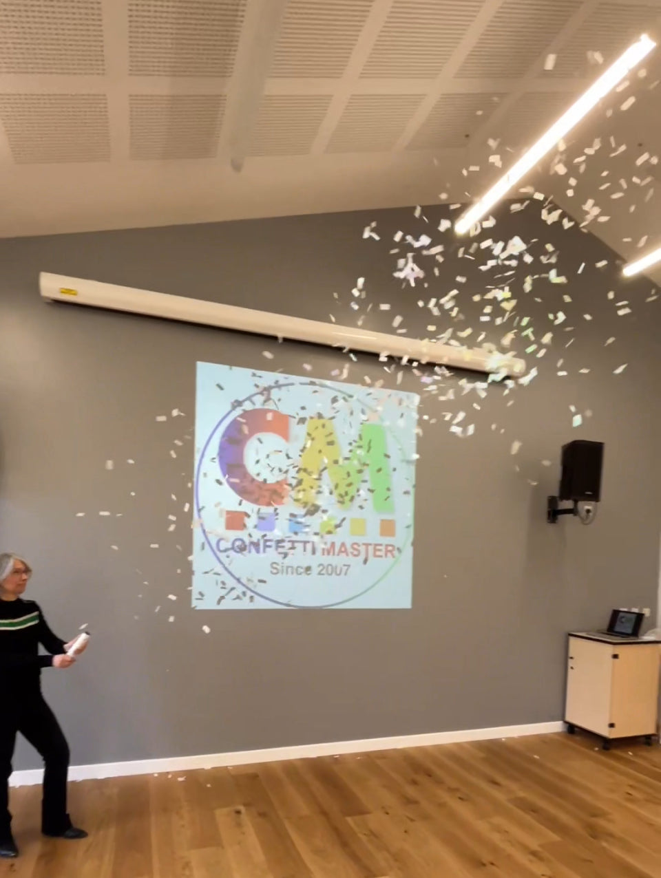 White confetti fired from a 20cm confetti cannon.