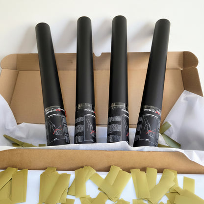 Pack of four upright confetti cannons in a box, filled with biodegradable gold confetti, ideal for celebrations.