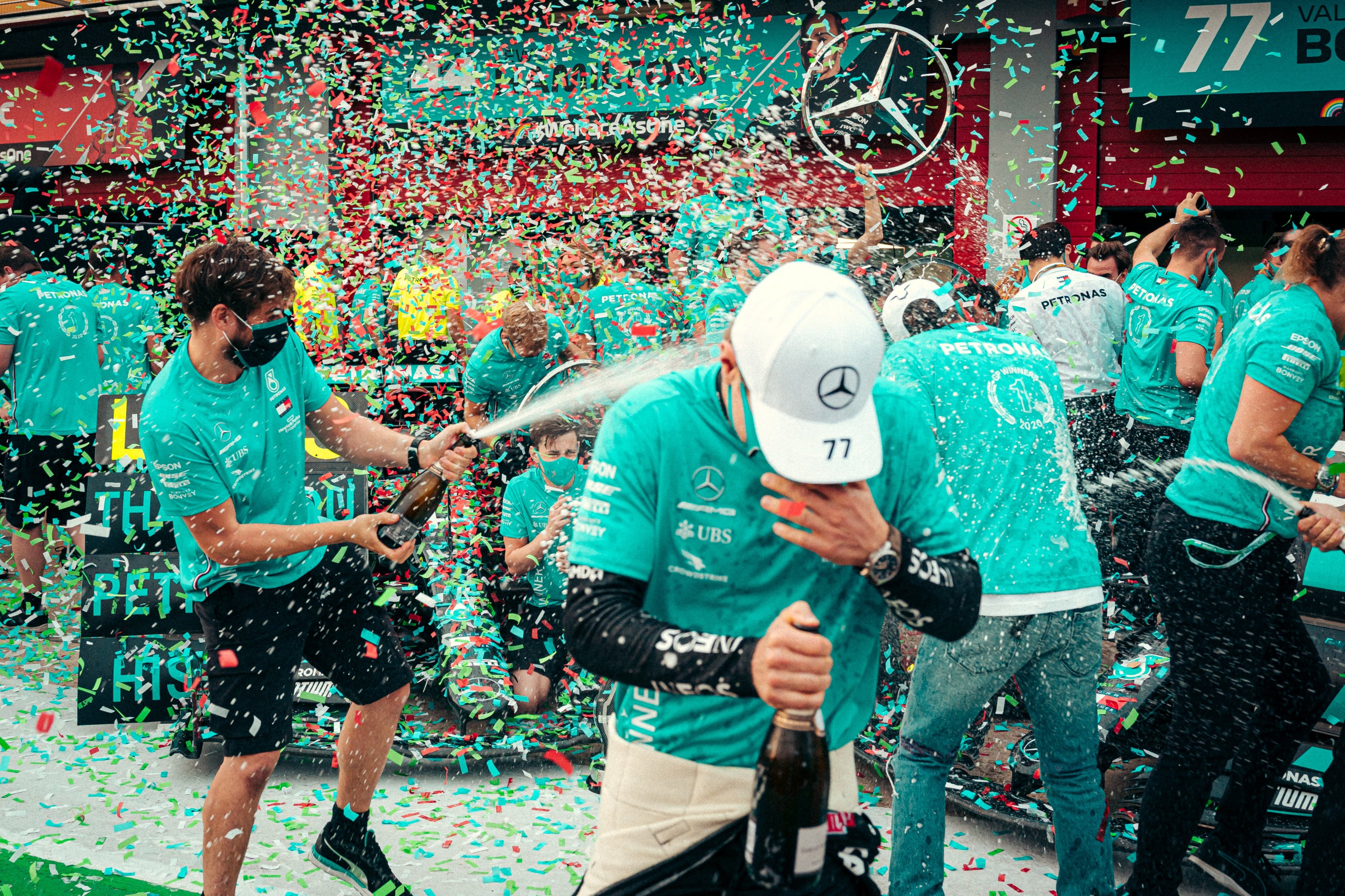 Confetti cannon fired over winning F1 team.