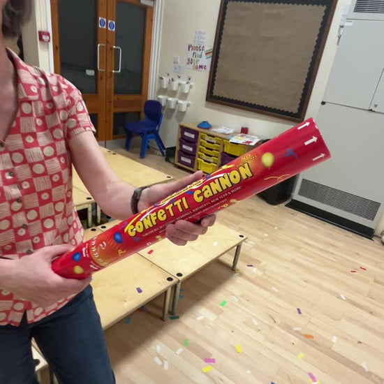 Confetti cannon being fired in school hall. The cannon contains biodegradable confetti. The video demonstrates the hight the confetti reaches and the payload of confetti in the cannon.